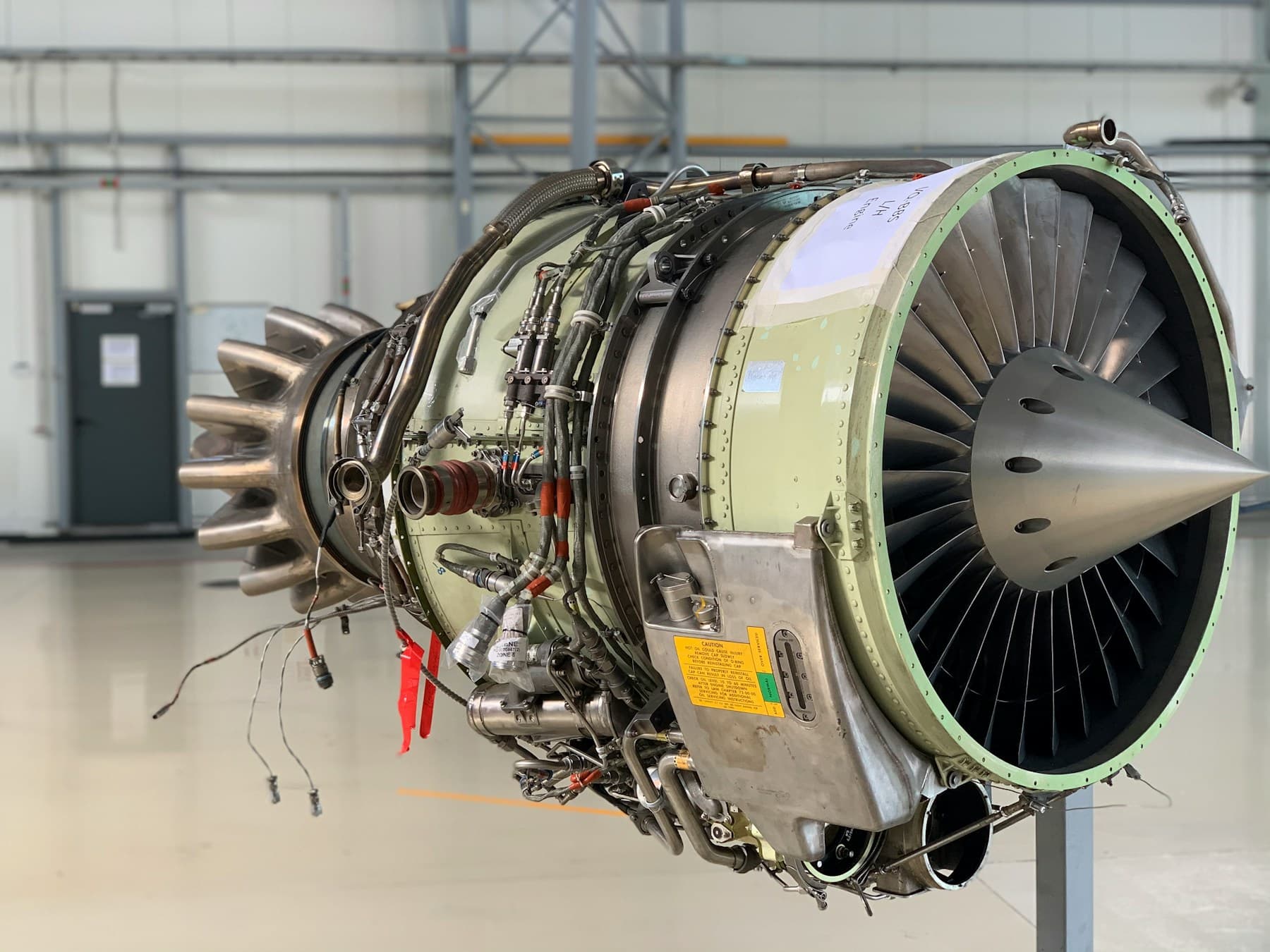 Gas turbine engine on a maintenance stand in a service hangar